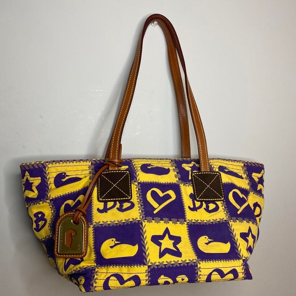 y2k dooney & bourke purple and yellow quirky whimsical duck and star pattern